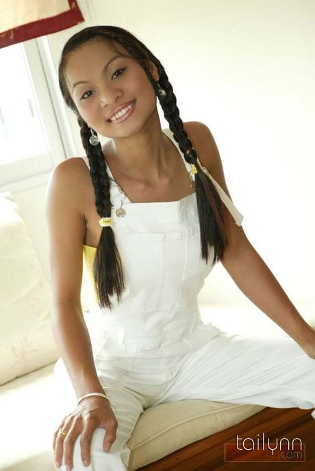 Thai girl Tailynn in pigtails shows off her asset