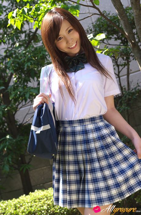 Schoolgirl Iyo Hanak poses at the open air in sexy skirt